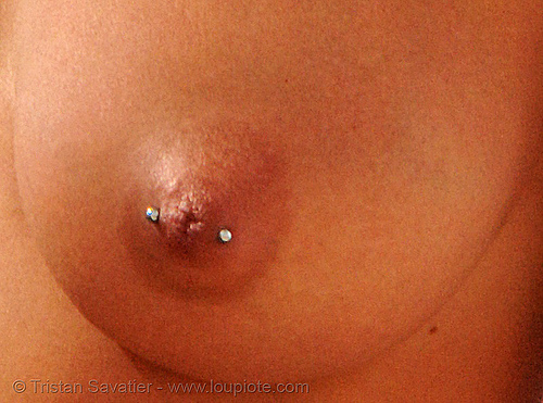 http://www.loupiote.com/moderate/photos_m/290252316-nipple-piercing.jpg