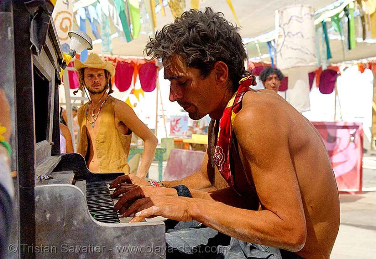  - 1363766986-christian-breeden-playing-piano-center-camp-burning-man