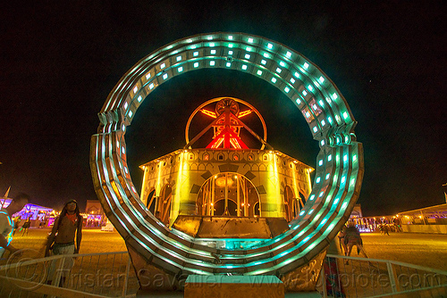 burning man - animated steel rings sculpture, animated, art installation, burning man at night, disc-go-sphere, glowing, led light, rings, sculpture, the man