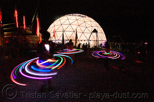 burning man - light hoopers near root society dome, burning man at night, geodesic dome, glowing, hooper, hula hoop, led hoop, led lights, light hoop, root society