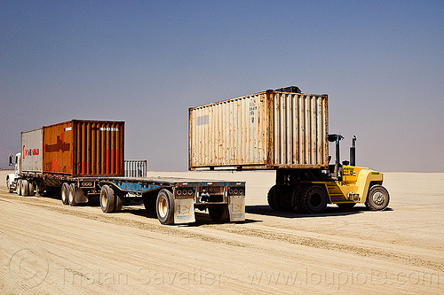 burning man - unloading containers from semi truck trailer, articulated lorry, containers, flat bed, forklift, semi trailer, semi truck, tractor-trailer, trucks, unloading