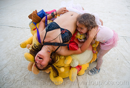 burning man - woman and child playing with the pooh-ball, child, kid, pooh ball, pooh bear ball, winnie the pooh