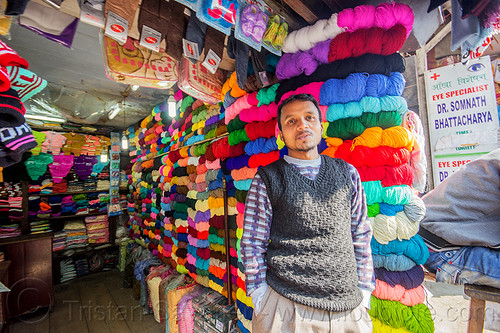 colorful cotton skeins in haberdashery - darjeeling (india), colorful, cotton skeins, darjeeling, haberdashery, man, merchant, notions shop, rainbow colors, shop owner, store, vendor, wool