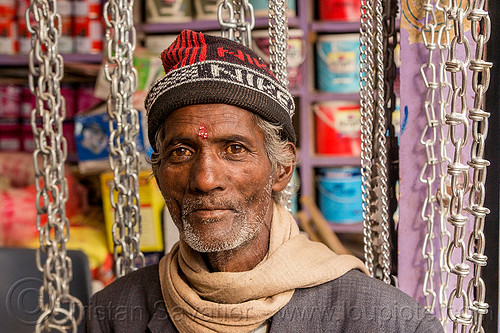 hindu chain merchant in his chains store (india), almora, chains, hardware, hindu, indian man, knitcap, merchant, scarf, shop, store, tilak, tilaka