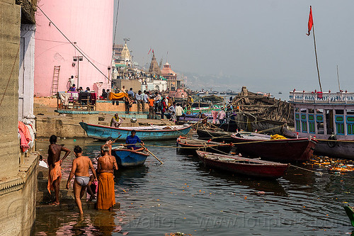 hindu holy bath in ganga river - ghats of varanasi (india), bathing pilgrims, ganga, ganges river, ghats, hindu, hinduism, holy bath, holy dip, mooring, nadi bath, pink tower, river bathing, river boats, varanasi, water tower
