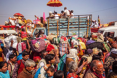 hindu pilgrims with bags in crowded street - kumbh mela (india), bags, bundles, crowd, exodus, float, gurus, hindu pilgrimage, hinduism, kumbh maha snan, kumbh mela, lorry, luggage, mauni amavasya, parade, truck, umbrella