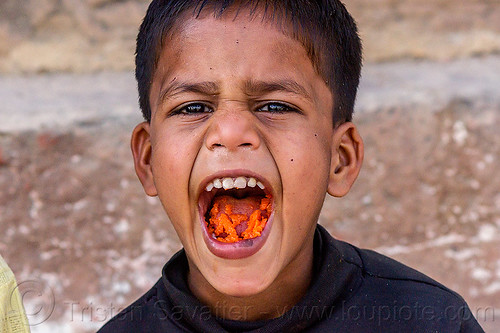 little boy's mouth full of carrots (india), boy, carrots, chewing, child, eating, kid, mouth, varanasi