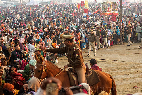 mounted police clearing access to sangam bathing area - kumbh mela (india), cops, crowd control, dawn, hindu pilgrimage, hinduism, horseback riding, kumbh maha snan, kumbh mela, mauni amavasya, mounted police, police horses, police officers, triveni sangam
