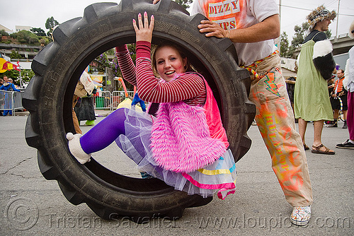 rolling in a tractor tire - burning man decompression, david, dizzy hips, man, tractor tire, tractor tyre, woman