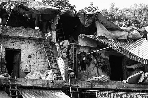 roofs of dilapidated shops, attic, building, climbing, cotton stores, delhi, dilapidated, handloom store, khurana handloom & cotton store, man, paharganj, pandit handloom & cotton store, roof, shelters, wooden ladders