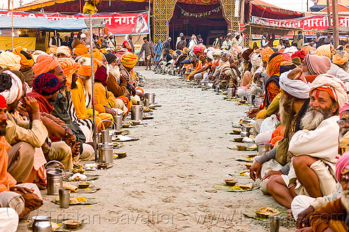 rows of hindu pilgrims eating holy prasad - kumbh mela 2013 (india), ashram, crowd, dinner, eating, food, hindu pilgrimage, hinduism, holy prasad, kumbh mela, men, pilgrims, rows, sitting