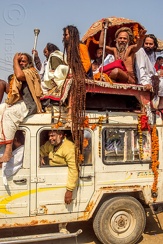sadhu with very long dreadlocks - kumbh mela (india), baba, beard, car, dreadlocks, float, gurus, hindu pilgrimage, hinduism, jeep, kumbh maha snan, kumbh mela, mauni amavasya, men, parade, sadhu, umbrella
