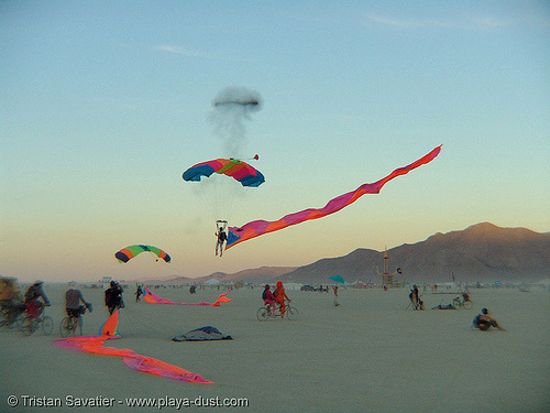 skydiver girl george landing with eel - burning man 2005, burning sky, eels, girl george, parachute, parachutist, skydiver, skydiving, streamer flags, streamers, woman