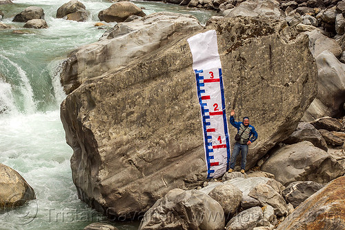 water level gauge painted on huge boulder in mountain stream (india), alaknanda river, alaknanda valley, flowing, hydrometric, man, mountain river, mountains, painted, staff gauge, water level, whitewater
