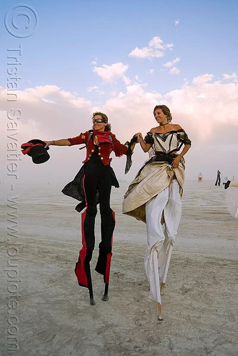 burning man, performers on stilts, anne and angela