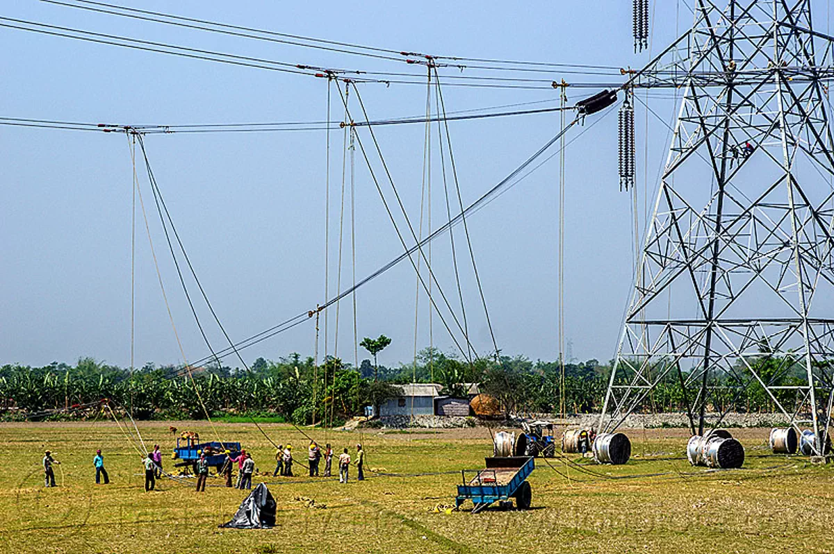 cable riggers installing power lines on transmission tower india cable riggers installing power lines on transmission tower india posters wall art stock photos royalty free images