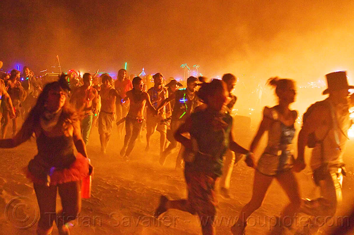 crowd running around the man's fire, burning man 2013