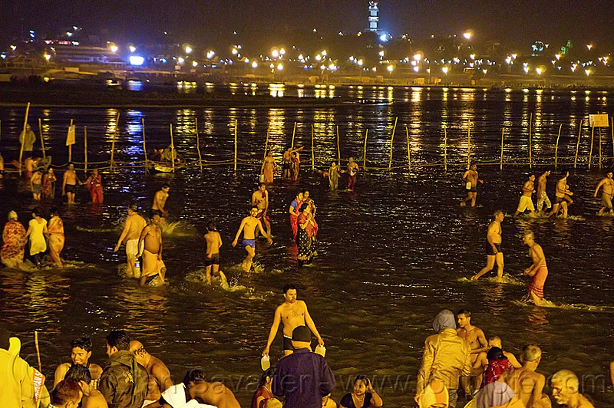 Hindu Pilgrims Bathing In The Ganges River At Sangam At Night Kumbh