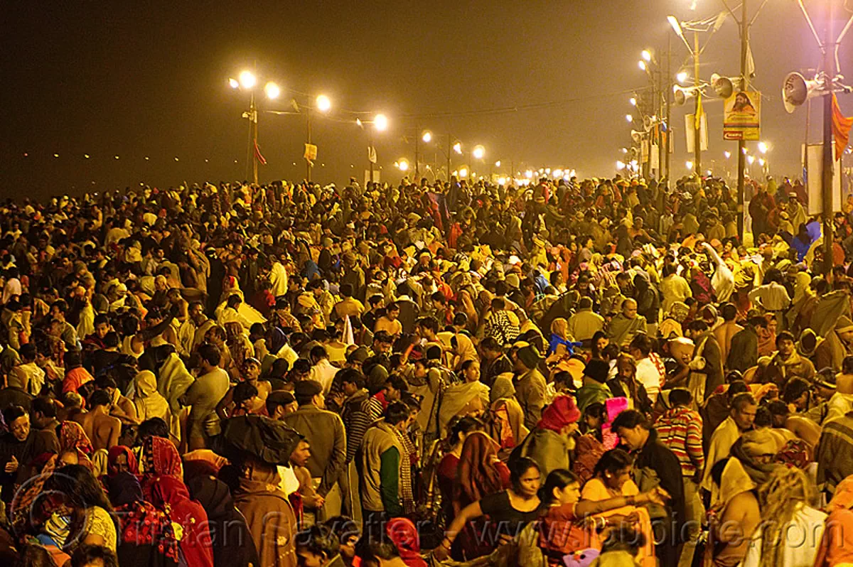 huge crowd of hindu pilgrims gathering at sangam for the holy bath in