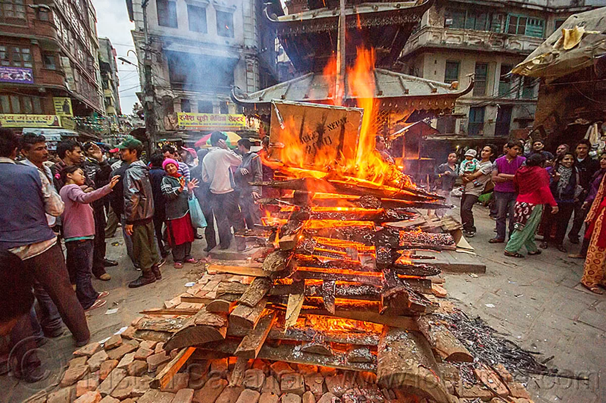 shivaratri fire near temple in the street of kathmandu, nepal