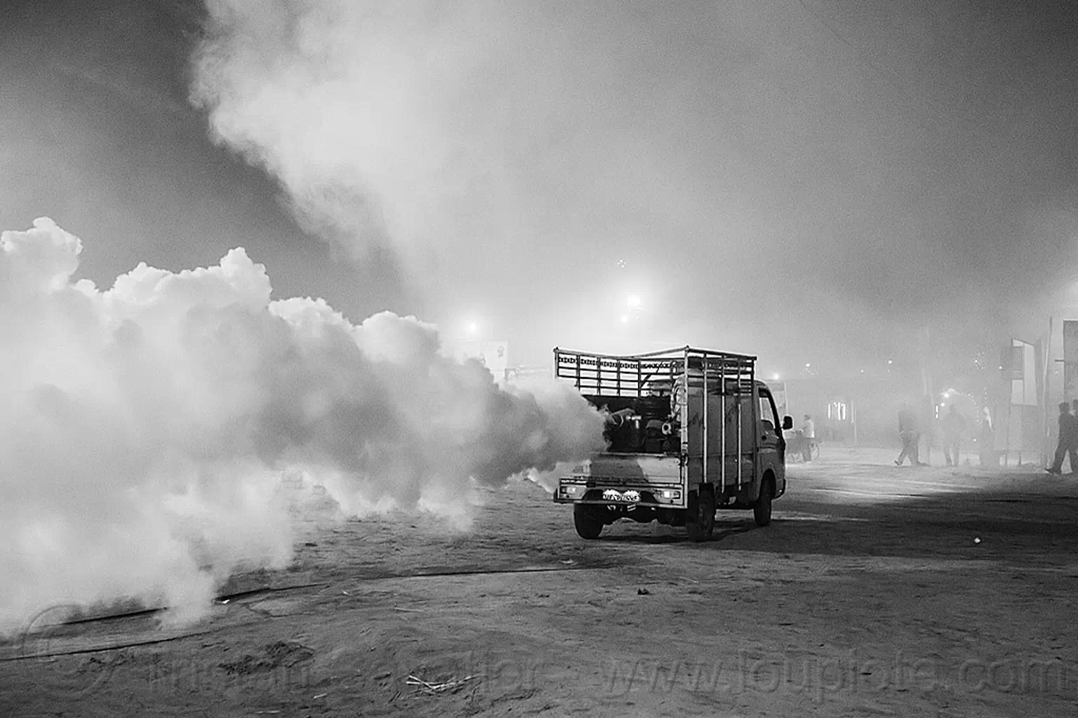 truck spraying DDT insecticide at kumbh mela 2013, india