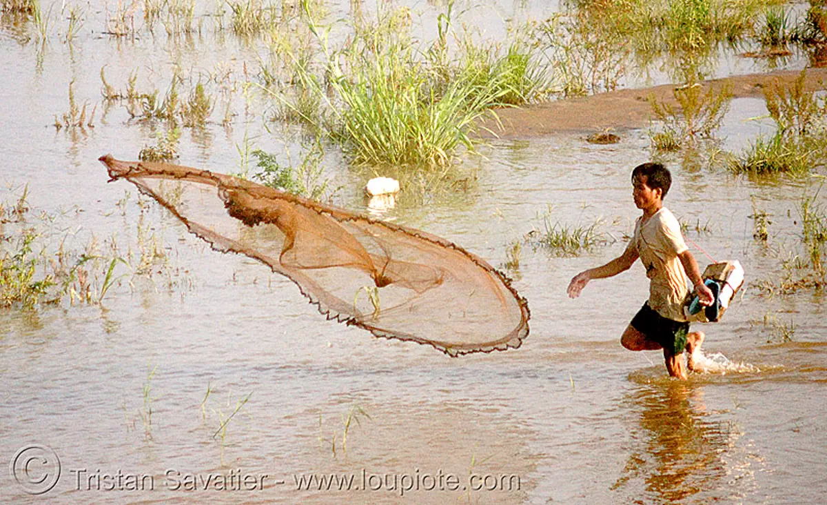 Fisherman Throwing Net - Mekong River