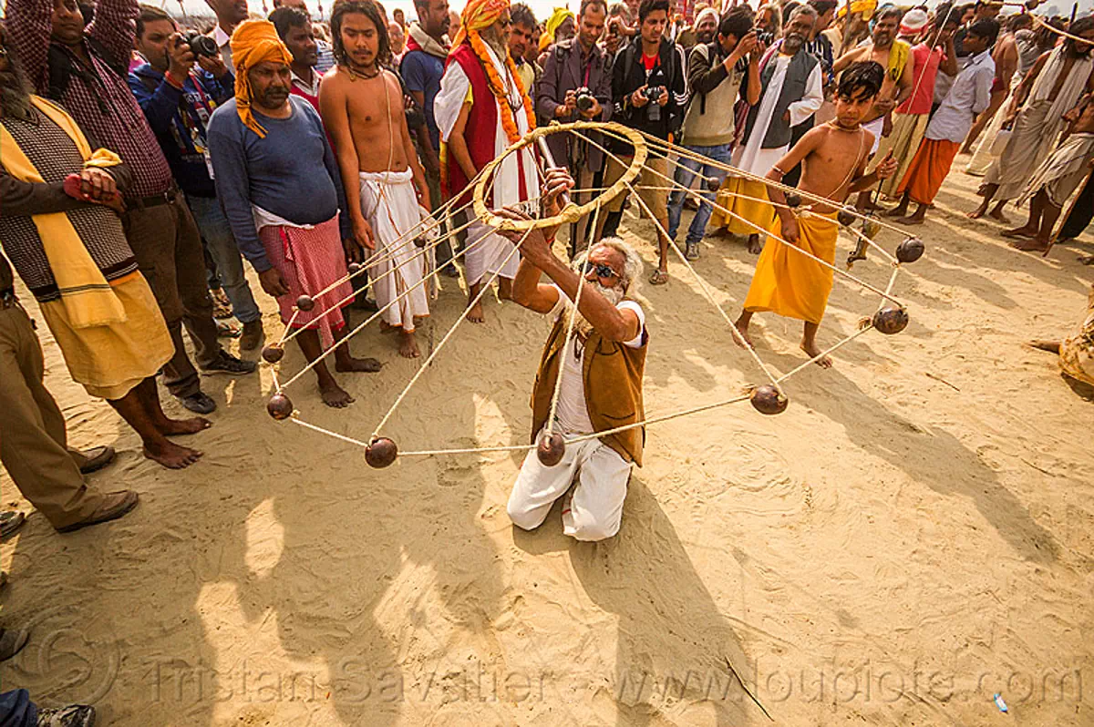 Old Man Spinning Balls with Ropes (India)