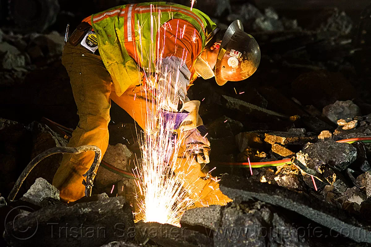 Welder Cutting a Track Rail with a Oxy-Acetylene Torch