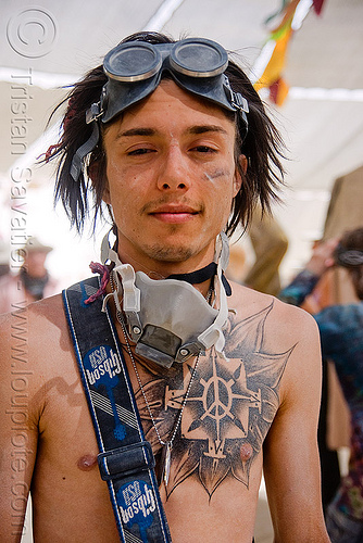 fire performer spinning fire staff, back tattoo, san francisco