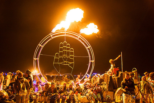 burning man - hamsa hand with fire - calico fagon art car, art car, burning man art cars, burning man at night, circle, crowd, fire, hamsa, hand of fatima, hand of miriam, mutant vehicles