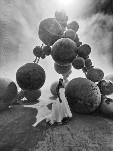 burning man - man in white wedding dress - toxic black balls, art installation, black balls, clayton blake, goggles, man, rubber balls, toxic, wedding dress