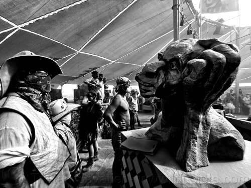 burning man - man looking at head sculpture at center camp cafe, head, sculpture