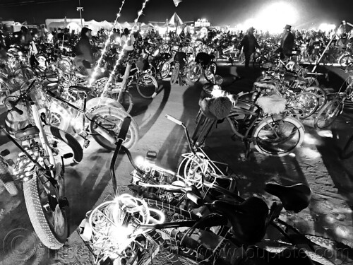 burning man - many parked bicycles glowing at night, bicycles, glowing