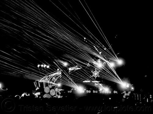 burning man - mayan warrior art car shooting laser beams, burning man art cars, burning man at night, lasers, mayan warrior art car, mutant vehicles