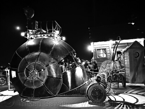 burning man - the golden mean snail car at night, animal art car, burning man at night, mutant vehicles, snail art car, the golden mean snail car