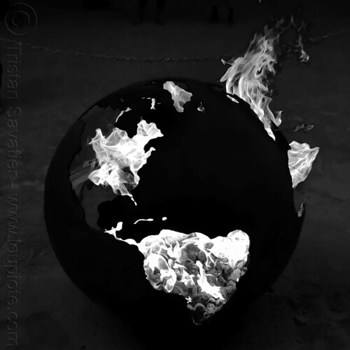 burning man - the world is burning - metal fire pit, art installation, burn barrel, burning man at night, globe steel fire pit