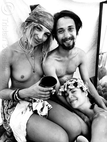 burning man - trio in shelter during dust storm, beard, bracelets, headdress, headwear, man, necklaces, sirsasana headstand, sitting, woman