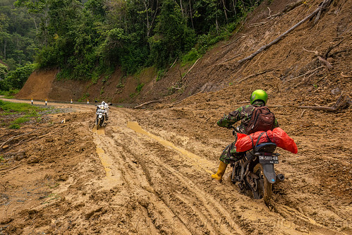 crossing a big mudslide with motorbike, men, motorcycle, mud, mudslide, road to bada valley
