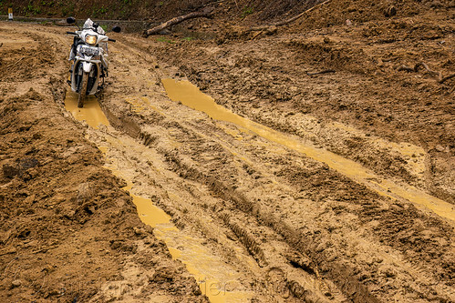 driving through a big mudslide with motorbike, motorcycle, mud, mudslide, road to bada valley