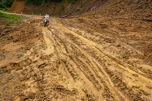 going through a big mudslide with motorbike, motorcycle, mud, mudslide, road to bada valley