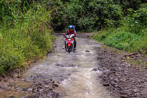going through a flooded dirt road with motorbike, flooded road, men, motorcycle, road to bada valley