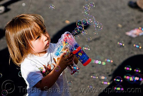 kid making soap bubbles with bubble gun, boy, bubble gun, darius, haight street fair, kid, playing, soap bubbles, toddler, toy gun, young child