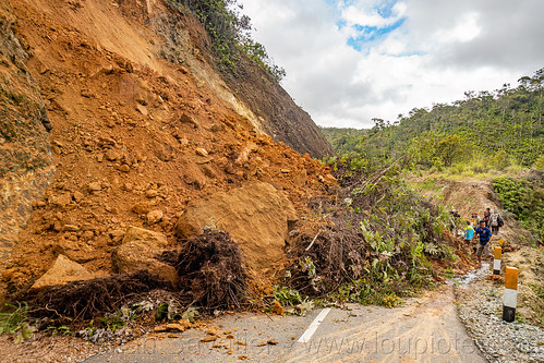 major landslide completely blocking road, bada valley road landslide, men, mountain road, road to bada valley
