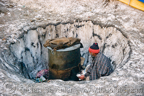 man heating water in a barrel - amarnath yatra (pilgrimage) - kashmir, amarnath yatra, barrel, hindu pilgrimage, hot water, kashmir, man, pilgrim, snow