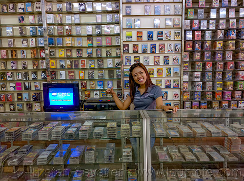 music mini-cassette tapes store in manado, cassette-tapes, manado, merchant, mini-cassettes, seller, shop, store, vendor, woman