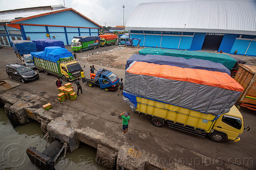 trucks waiting to board ro-ro ferryboat ship, surabaya