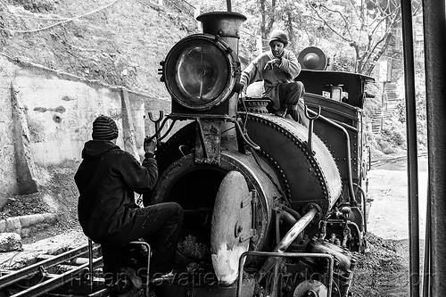 workers inspecting the boiler of a steam locomotive - darjeeling (india), 791, boiler, darjeeling himalayan railway, darjeeling toy train, fixing, men, narrow gauge, railroad, repairing, steam engine, steam locomotive, steam train engine, train depot, train yard, workers