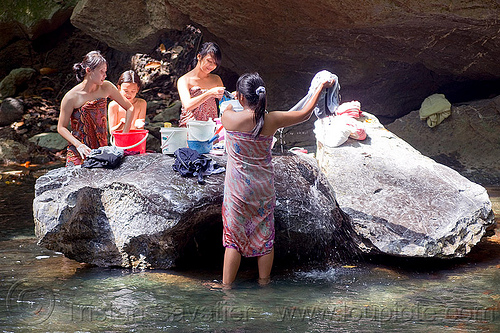 young women doing laundry in river, borneo, child, kid, laundry, little girl, malaysia, river, rock, wading, washing, women